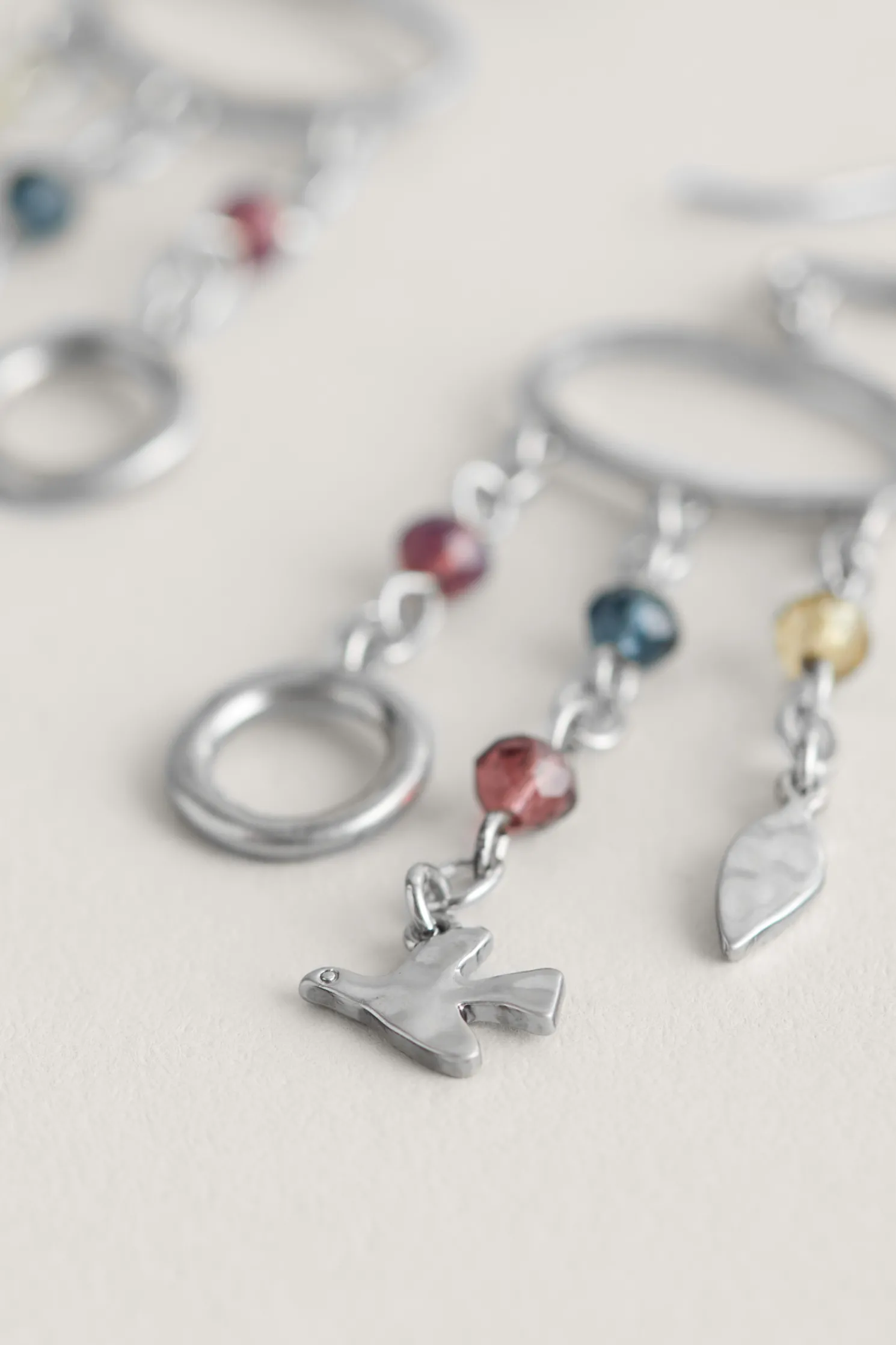 Chy Silver Tone Charm Earrings